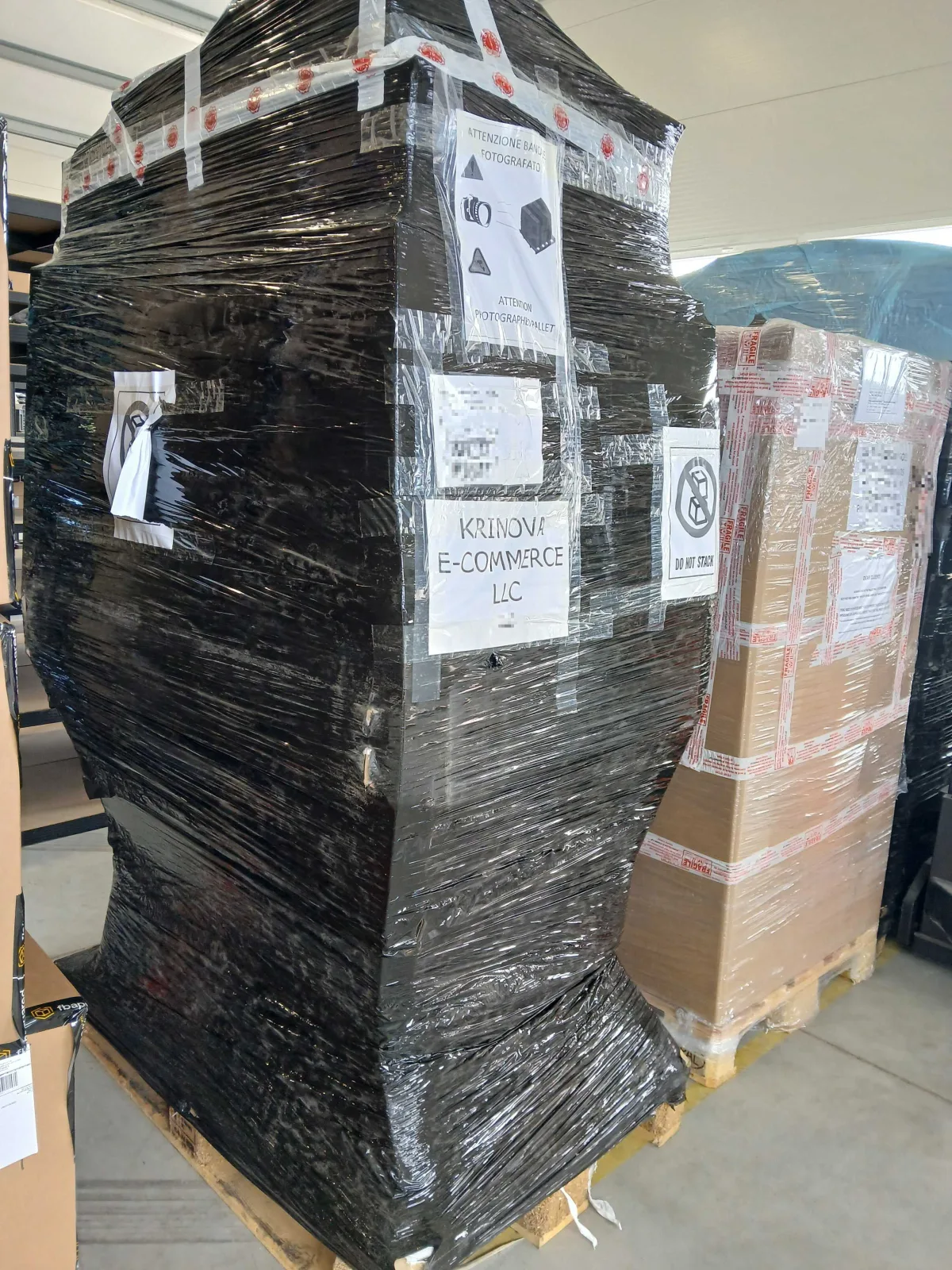 Stretch-wrapped KRINOVA pallets with shipping labels, staged for outbound freight